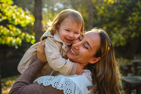 woman hugging a child