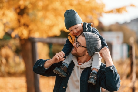 father and son playing outside